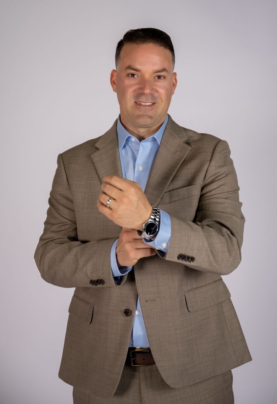 Professional headshot of a man in a tailored suit
