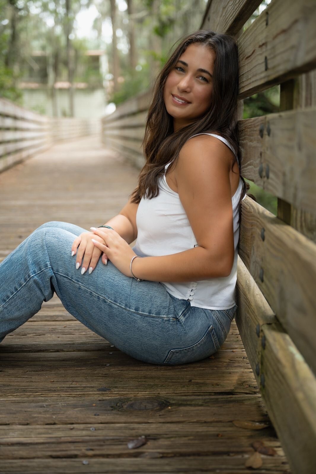 Senior portrait on a wooden boardwalk